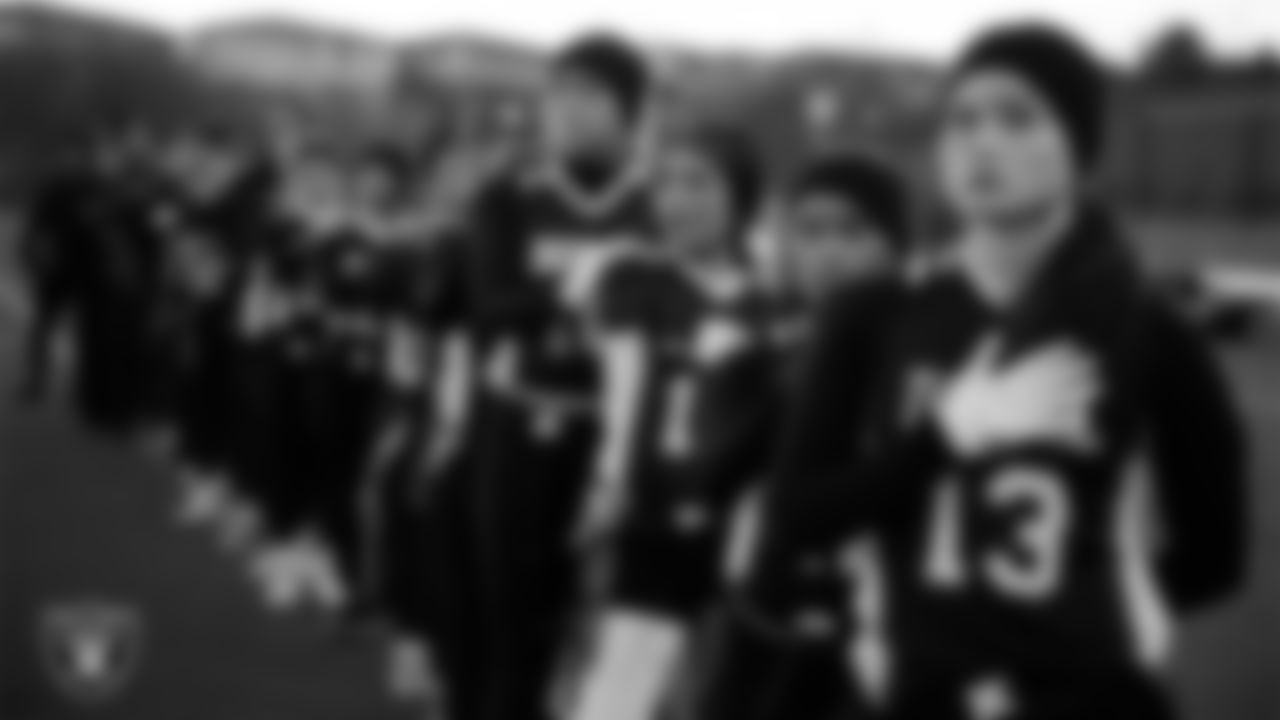 The Doral Academy Red Rock flag football team during the anthem before the Las Vegas Raiders' High School Flag Football Showcase at Doral Academy Red Rock.