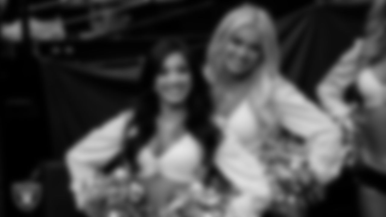 Raideretts Tatiana and Pip walk through the tunnel before the regular season home game against the Kansas City Chiefs at Allegiant Stadium.