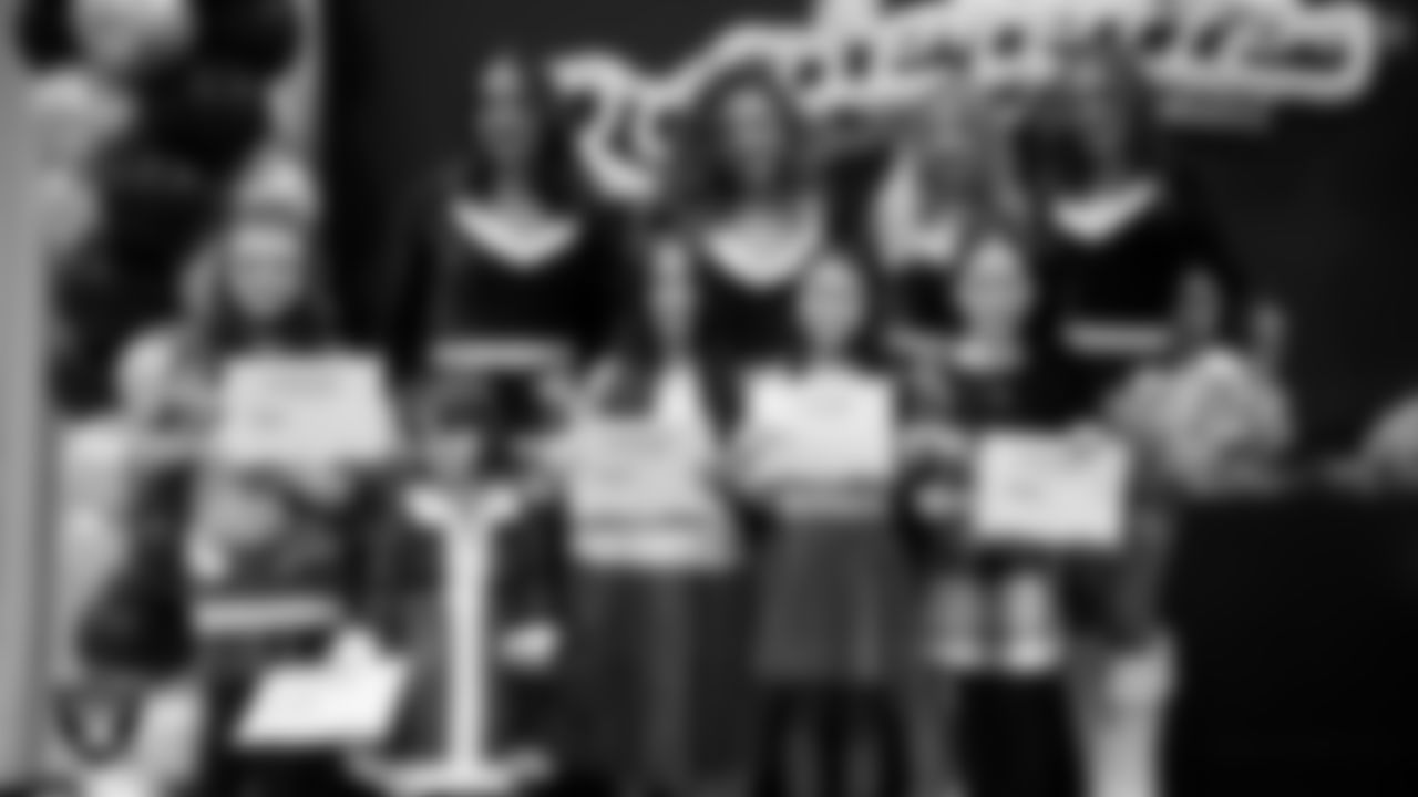 Raiderettes pose for a photo with Junior Raiderettes during the Junior Raiderettes Banquet at The Studio.