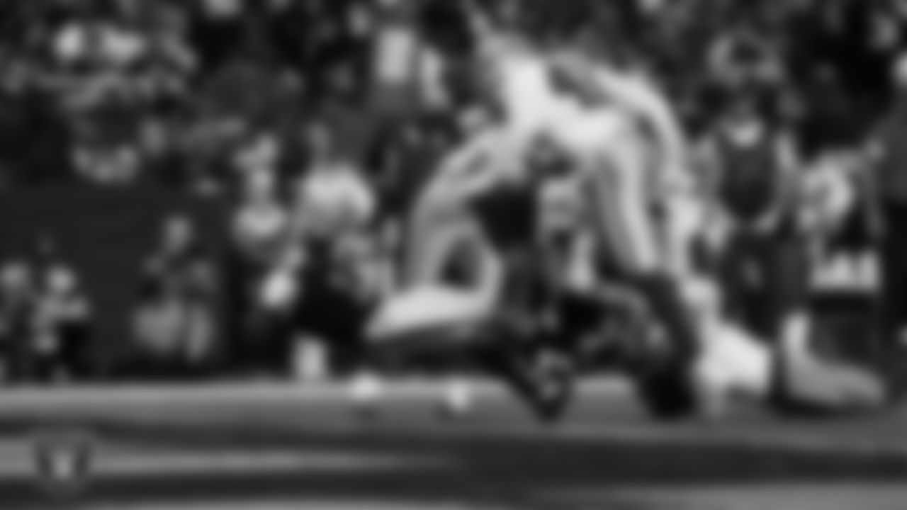 Las Vegas Raiders wide receiver Tre Tucker (1) dives into the end zone after making a 6-yard touchdown catch during the regular season home game against the Dallas Cowboys at Allegiant Stadium.