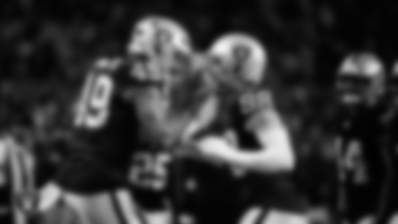 Las Vegas Raiders defensive end Maxx Crosby (98) celebrates with defensive end Charles Snowden (49) after forcing a fumble during the regular season home game against the Dallas Cowboys at Allegiant Stadium.