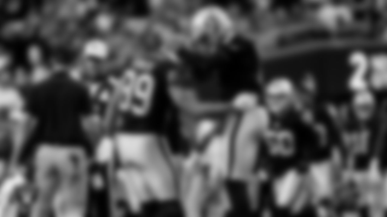 Las Vegas Raiders tight end Brock Bowers (89) celebrates with quarterback Geno Smith (7) after making a 7-yard touchdown catch during the regular season home game against the Jacksonville Jaguars at Allegiant Stadium.