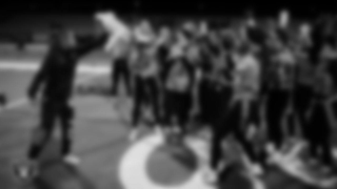 Las Vegas Raiders manager of football development Marli Bartlett presents the championship belt to the Palo Verde High School flag football team after the Raiders' High School Flag Football Showcase game at Coronado High School.