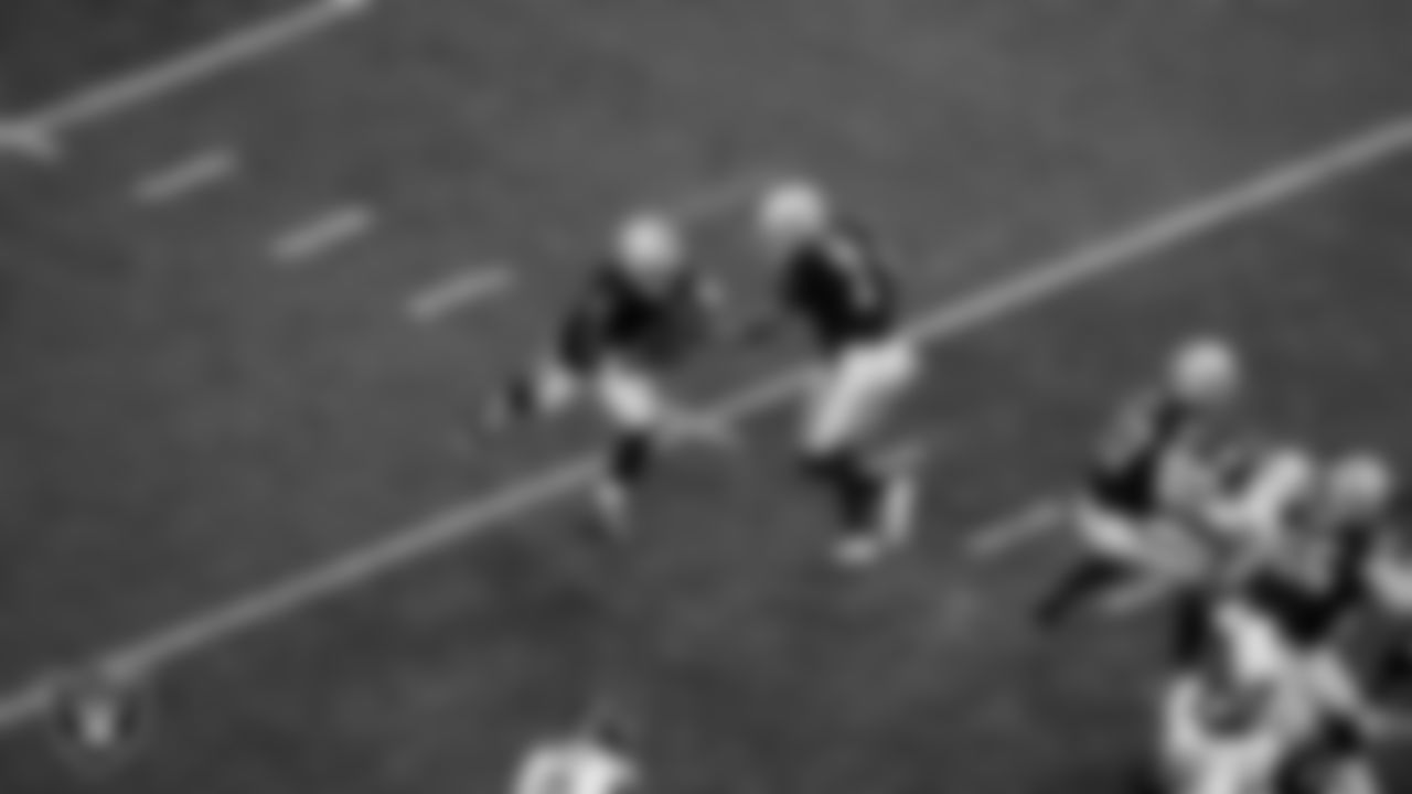 Las Vegas Raiders running back Ashton Jeanty (2) and quarterback Geno Smith (7) during the regular season home game against the New York Giants at Allegiant Stadium.