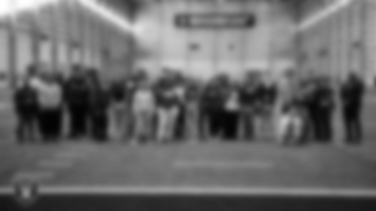 Canyon Spring High School students pose for a photo on the indoor field during the Employee Resource Group Mentorship Program at Las Vegas Raiders Headquarters.