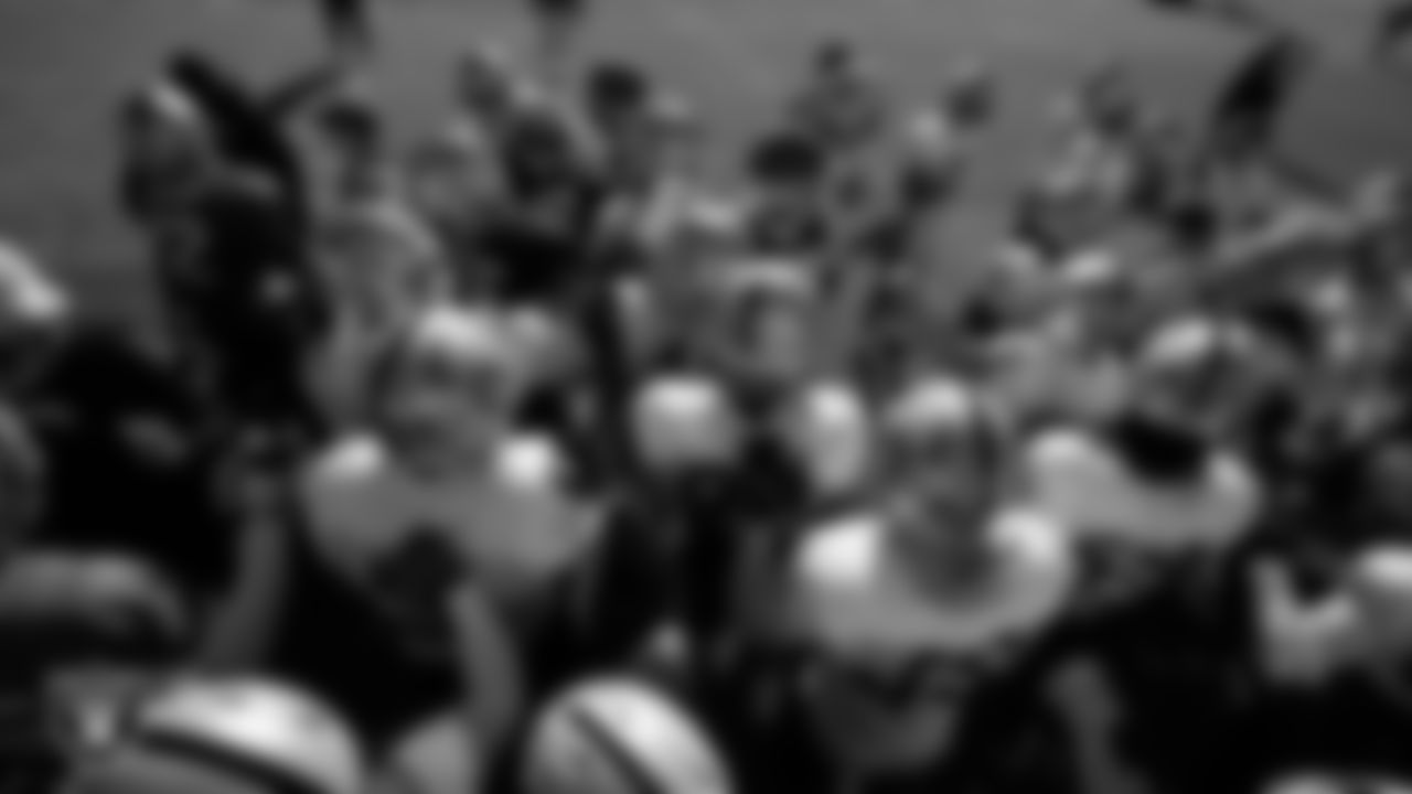 The Las Vegas Raiders huddle during practice at Intermountain Health Performance Center.