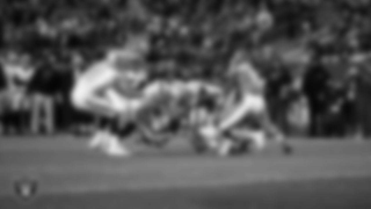 Las Vegas Raiders cornerback Eric Stokes (22) makes a tackle during the regular season away game against the Denver Broncos at Empower Field at Mile High.