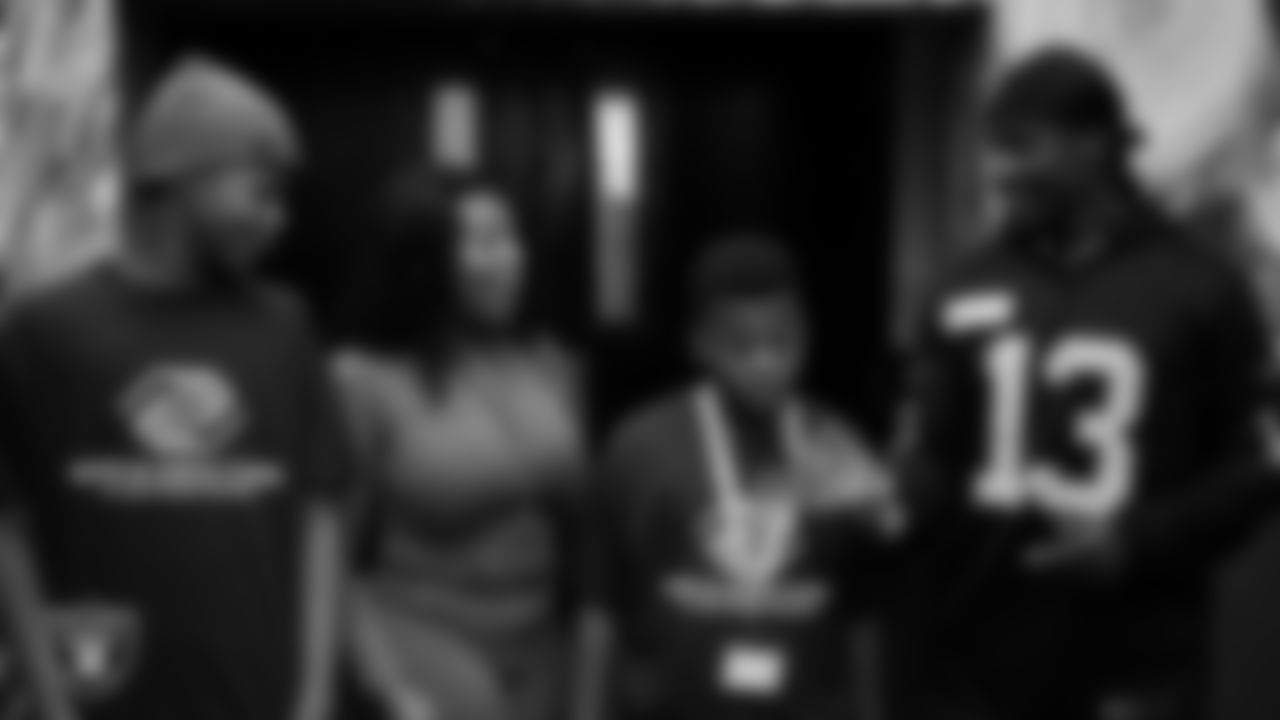 Las Vegas Raiders wide receiver Phillip Dorsett II (13) surprises members of the Boys and Girls Club with tickets to a Raiders game at the Lied Memorial Boys & Girls Clubs of Southern Nevada.