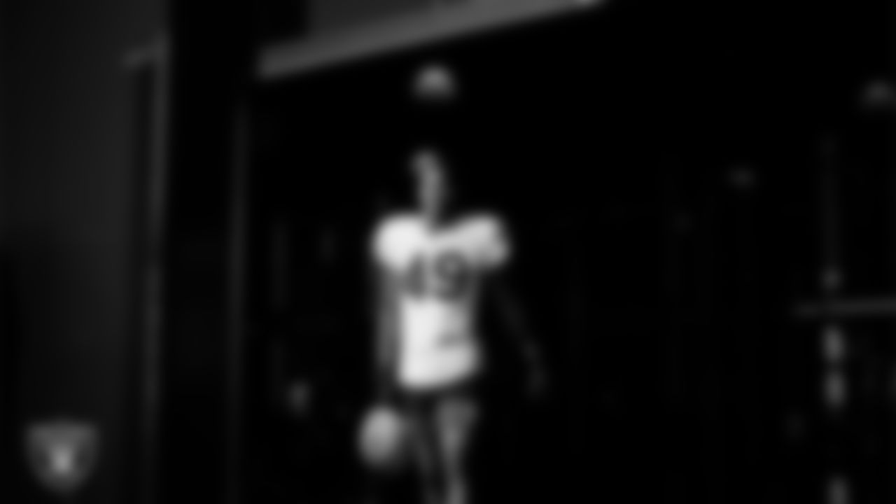 Las Vegas Raiders defensive end Charles Snowden (49) walks out to the field for practice at Intermountain Health Performance Center.