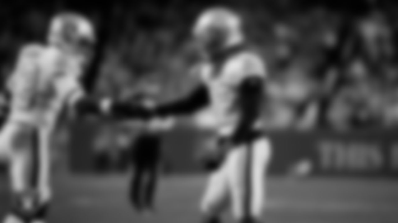 Las Vegas Raiders cornerback Eric Stokes (22) celebrates with linebacker Jamal Adams (33) after making a tackle during the regular season away game against the Denver Broncos at Empower Field at Mile High.