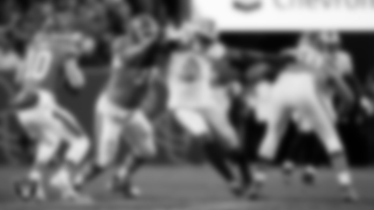 Las Vegas Raiders defensive end Tyree Wilson (9) pressures the quarterback during the regular season away game against the Denver Broncos at Empower Field at Mile High.