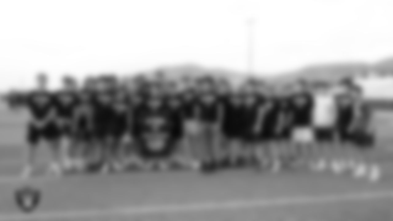 Damonte Ranch High School football players pose for a photo after winning the Fastest Man challenge during a Las Vegas Raiders 11-ON event at Damonte Ranch High School.