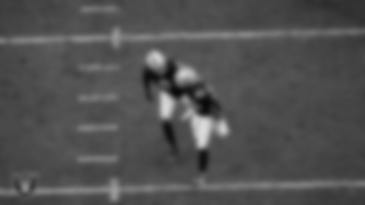 Las Vegas Raiders defensive tackle Jonah Laulu (96) celebrates with defensive end Tyree Wilson (9) after sacking the quarterback during the regular season home game against the Tennessee Titans at Allegiant Stadium.