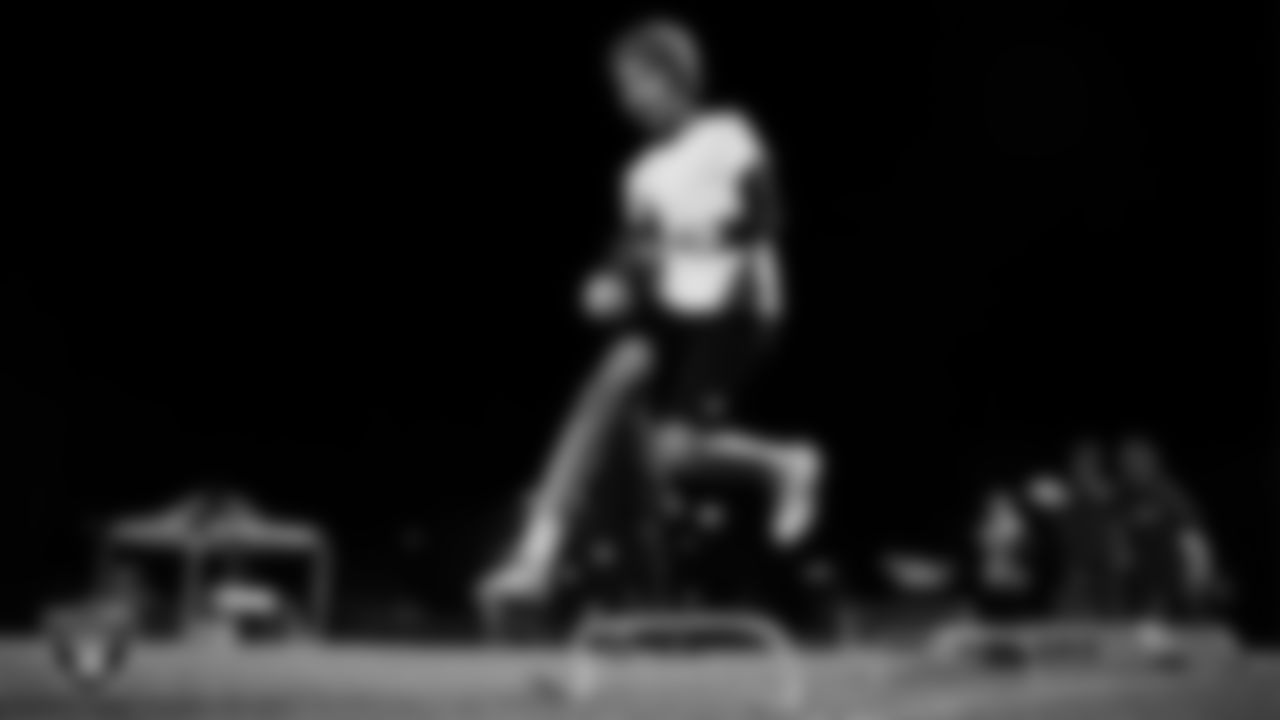 An athlete takes part in a Silver and Black League flag football clinic at Bill and Lillie Heinrich YMCA.