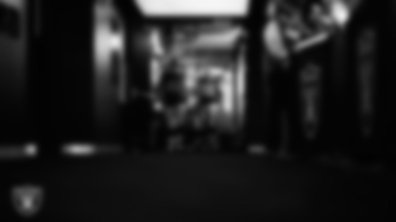 Las Vegas Raiders center/guard Jordan Meredith (61) and guard Alex Cappa (65) walk down the tunnel before the regular season home game against the Dallas Cowboys at Allegiant Stadium.