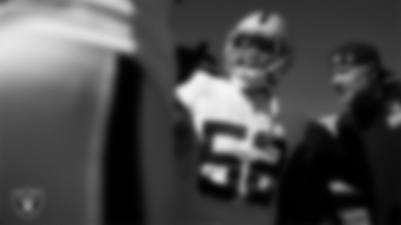 Las Vegas Raiders linebacker Elandon Roberts (52) in a huddle before the regular season away game against the Kansas City Chiefs at GEHA Field at Arrowhead Stadium.