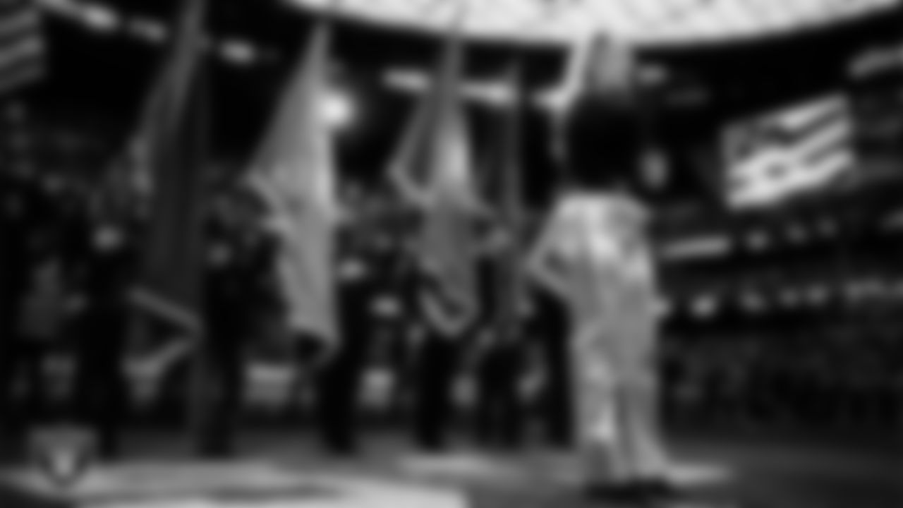 Singer and songwriter Joelle James performs the national anthem while Nevada First Responders present the nation's colors before the Las Vegas Raiders' regular season home game against the New York Giants at Allegiant Stadium.