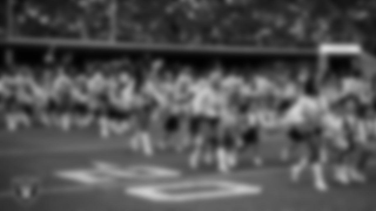 The Raiderettes and Junior Raiderettes enter the field for their performance on the field before the preseason home game against the San Francisco 49ers at Allegiant Stadium.