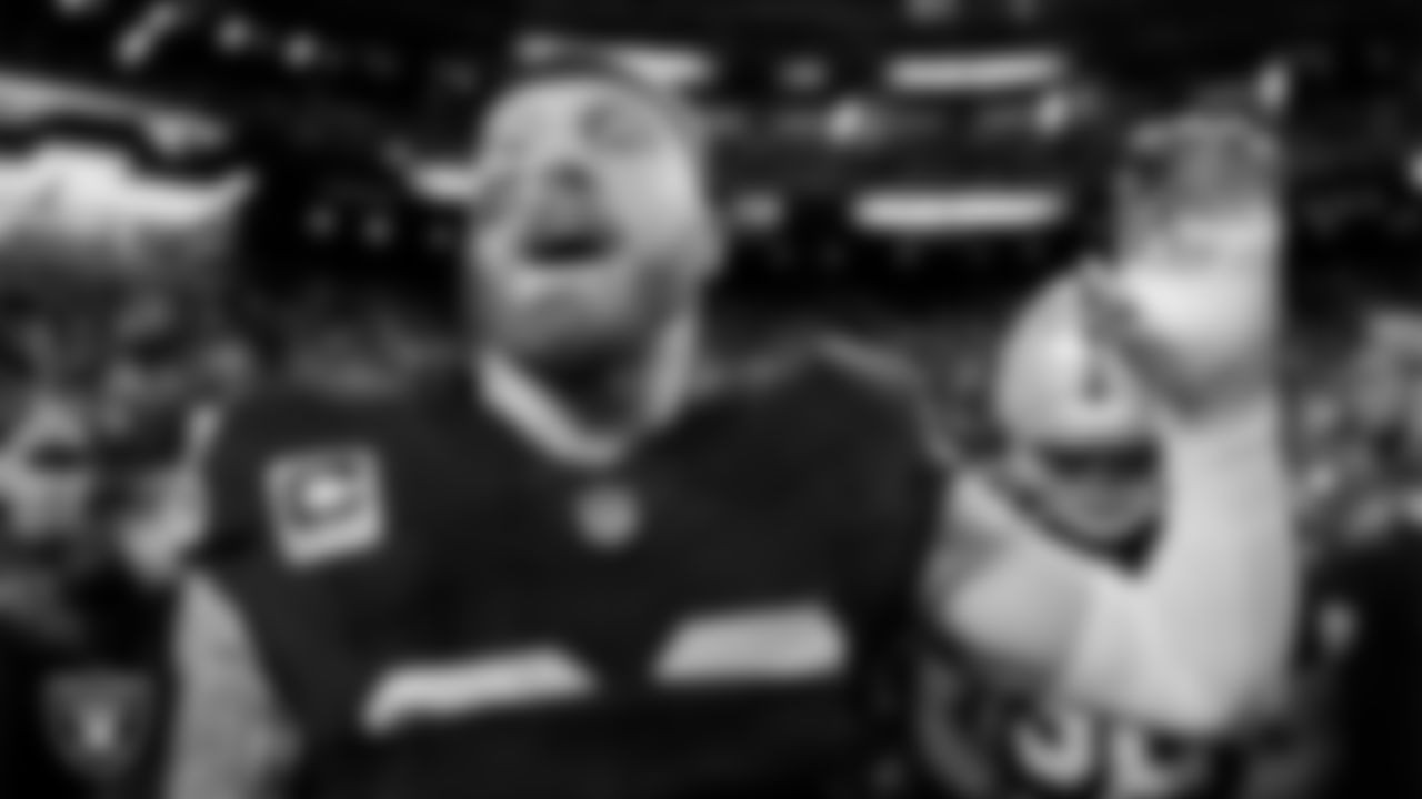 Las Vegas Raiders defensive end Maxx Crosby (98) in a huddle before the regular season home game against the Dallas Cowboys at Allegiant Stadium.