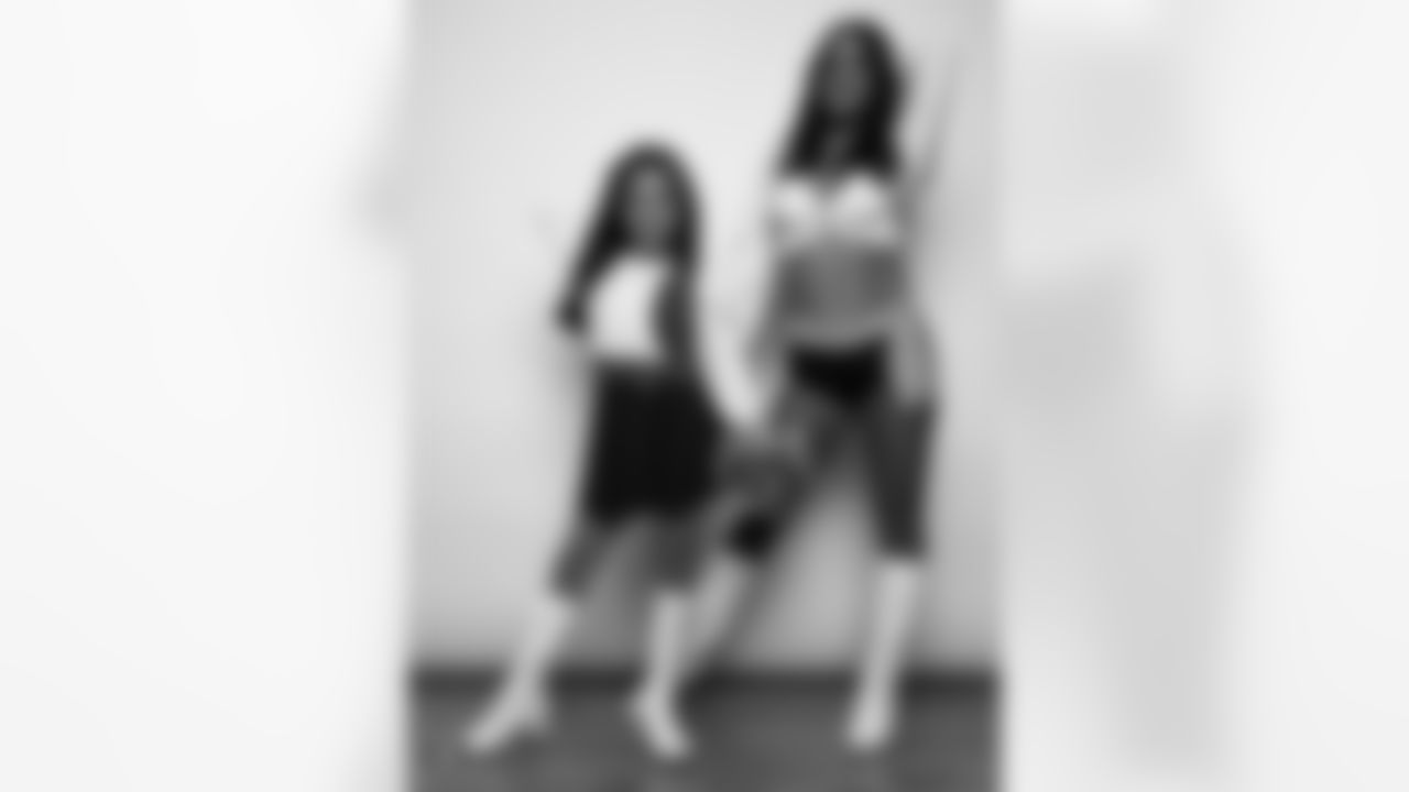 Raiderette Reagan poses for a photo with a Junior Raiderette during 2025 Media Day at The Studio.