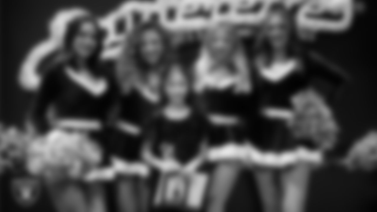 Raiderettes pose for a photo with a Junior Raiderette during the Junior Raiderettes Banquet at The Studio.