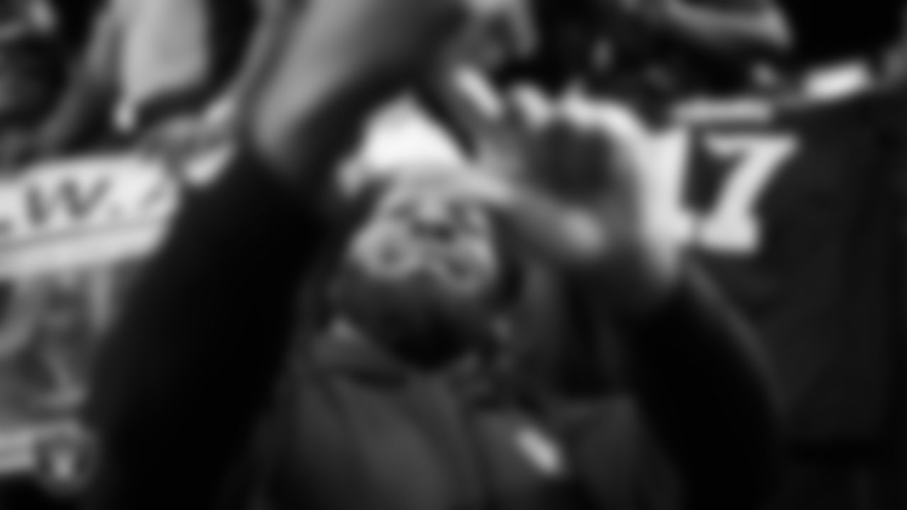 Las Vegas Raiders defensive tackle John Jenkins (95) takes a selfie with fans before the regular season home game against the New York Jets at Allegiant Stadium.