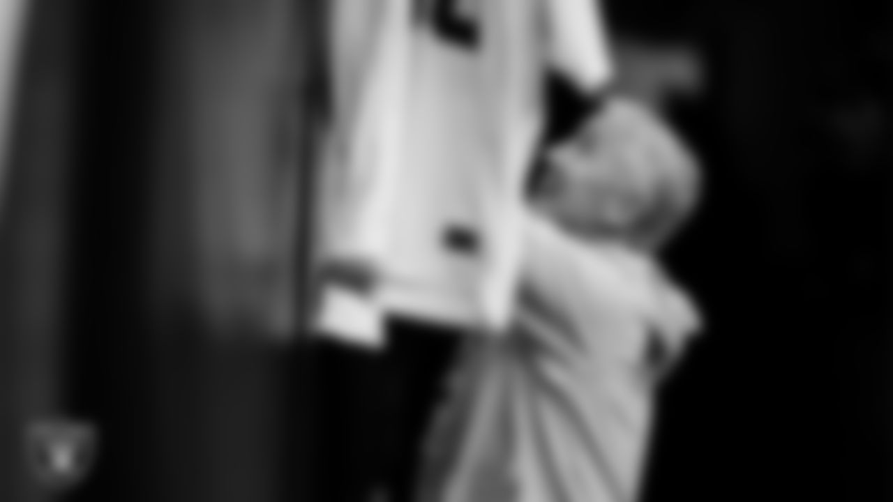 Las Vegas Raiders Head Coach Pete Carroll signs autographs for fans before the regular season away game against the Houston Texans at NRG Stadium.