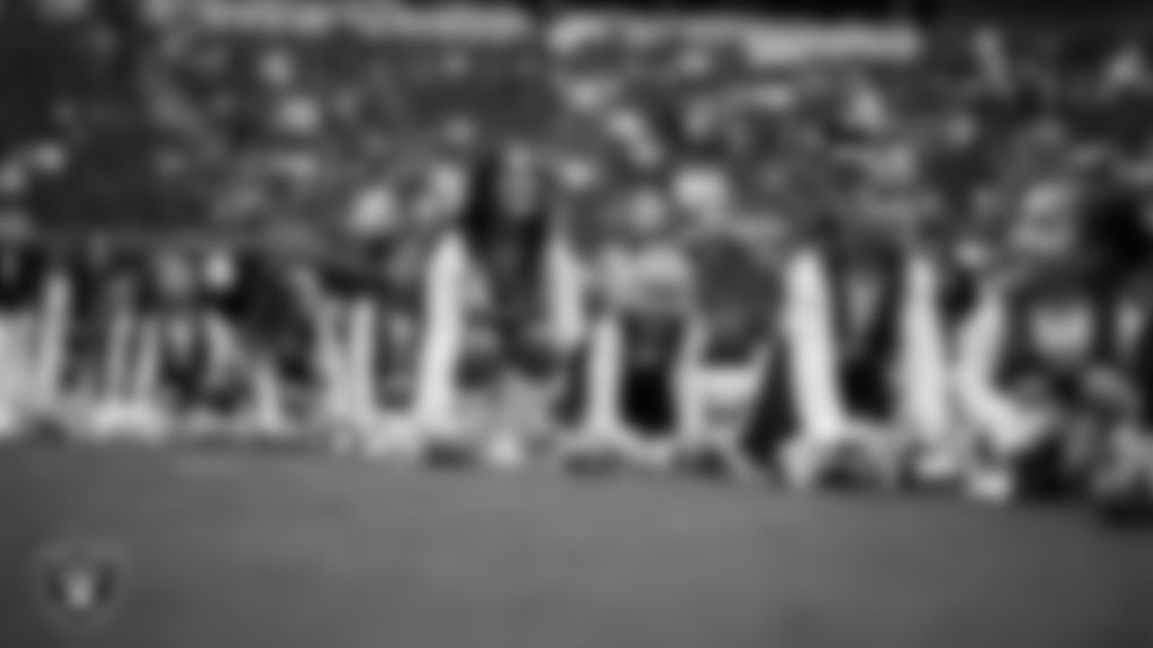Raiderette Amanda and Junior Raiderettes perform on the field before the preseason home game against the San Francisco 49ers at Allegiant Stadium.