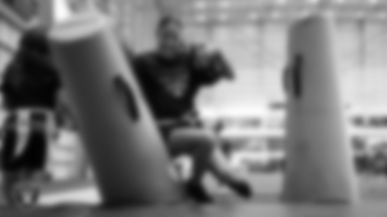 A student goes through a drill during a Raiders Junior Training Camp at Intermountain Health Performance Center.