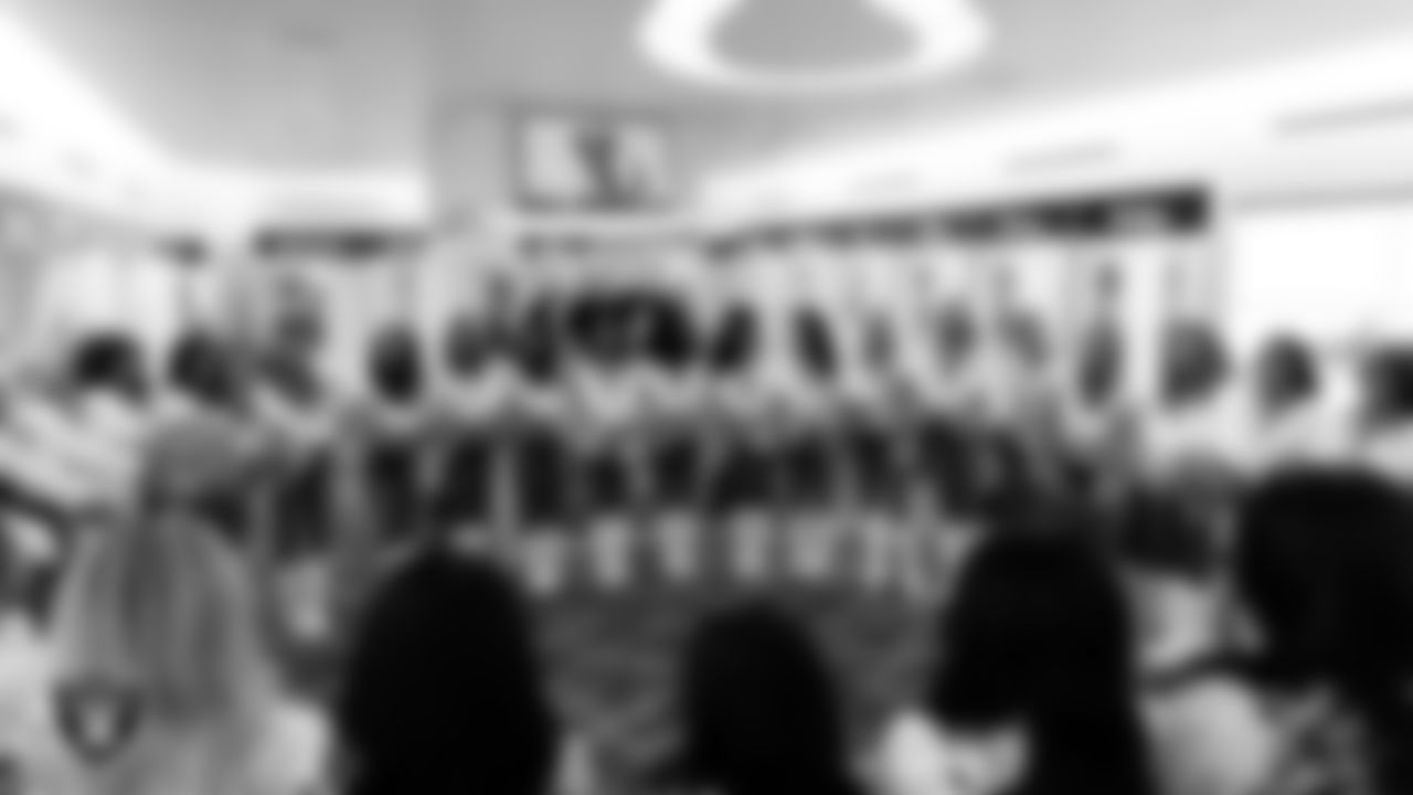 The Raiderettes huddle in the locker room before the regular season home game against the Dallas Cowboys at Allegiant Stadium.