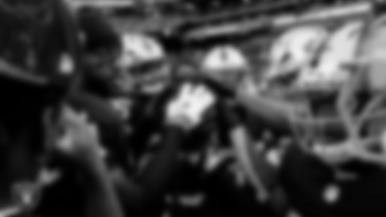 The Las Vegas Raiders defensive backs huddle before the regular season home game against the Tennessee Titans at Allegiant Stadium.