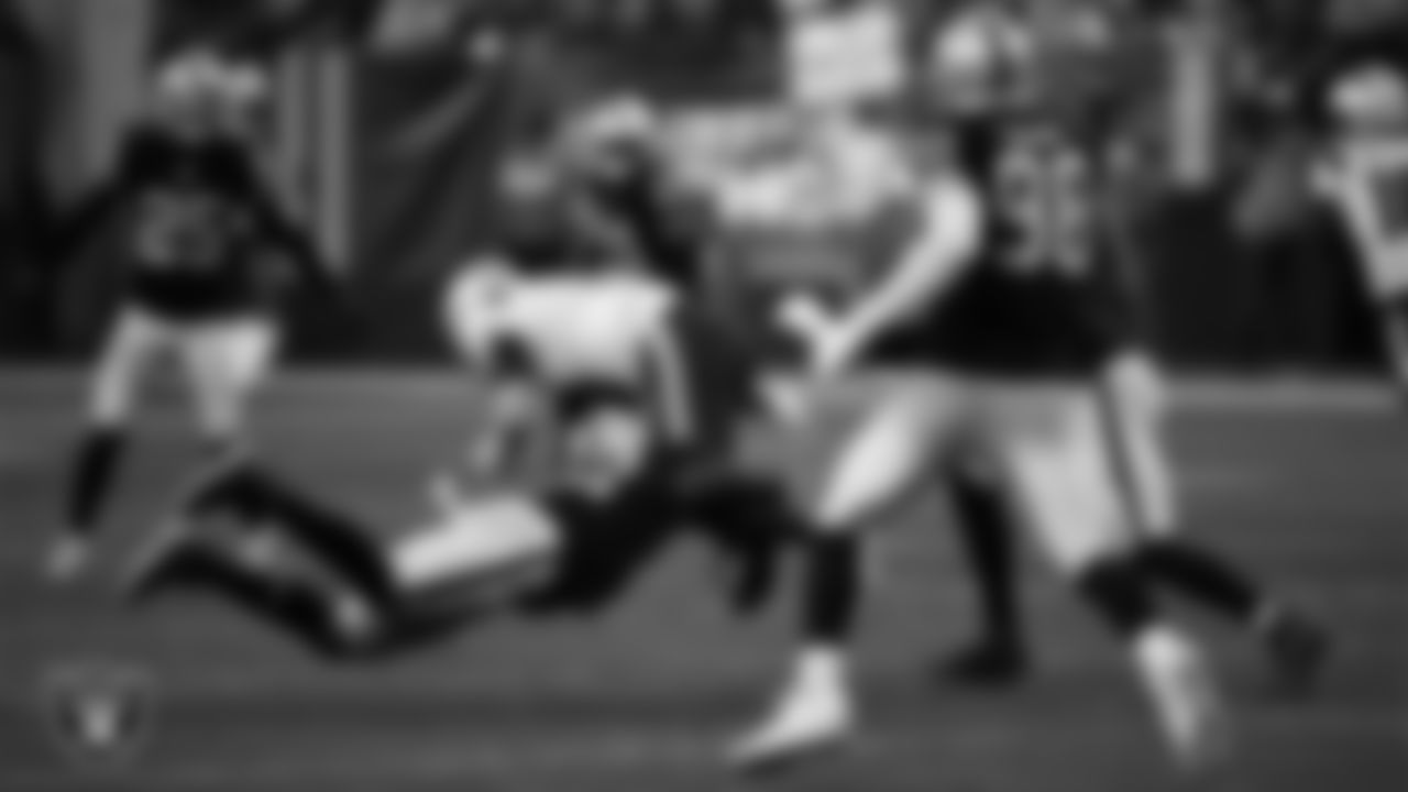 Las Vegas Raiders linebacker Denzel Perryman (52) makes a tackle during the regular season home game against the New England Patriots at Allegiant Stadium, Sunday, December 18, 2022, in Las Vegas, Nev.