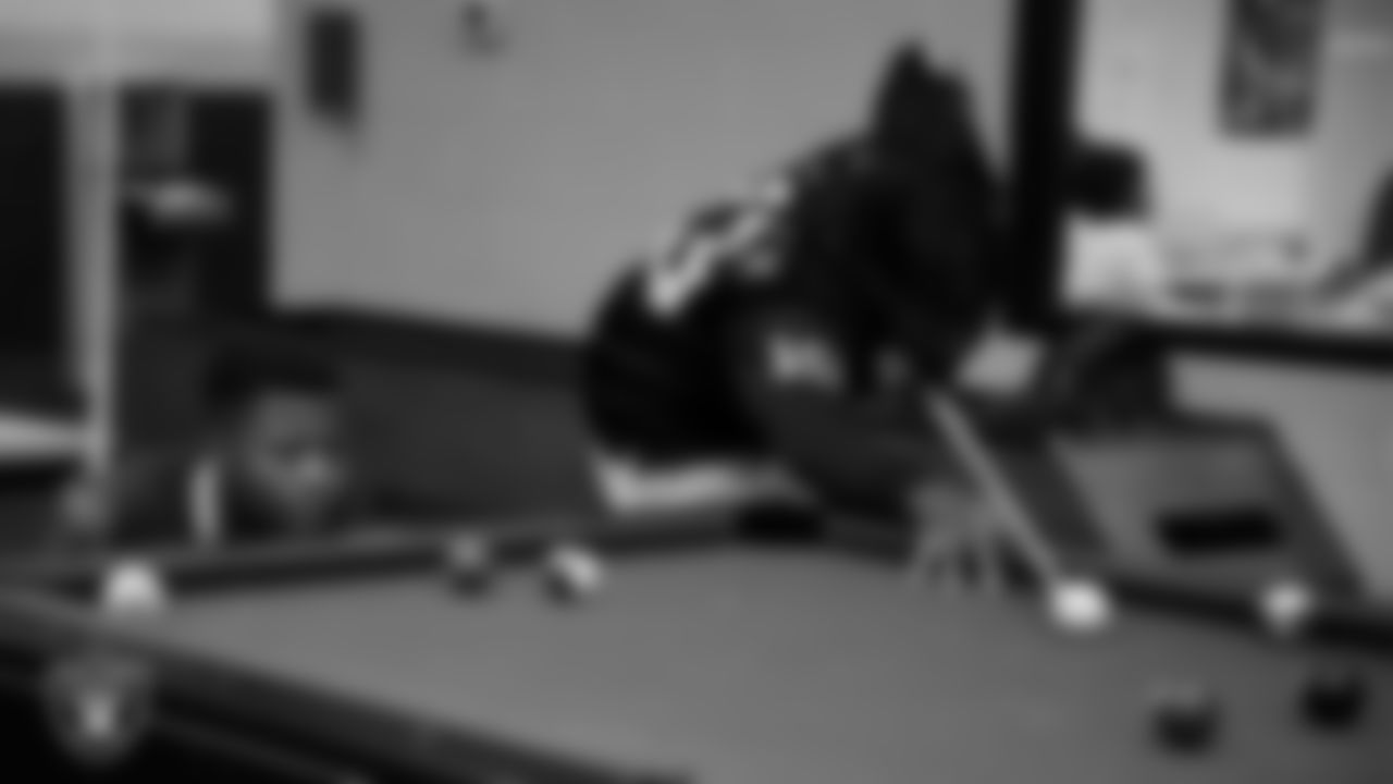 Las Vegas Raiders wide receiver Phillip Dorsett II (13) shoots pool with members of the Boys and Girls Club at the Lied Memorial Boys & Girls Clubs of Southern Nevada.