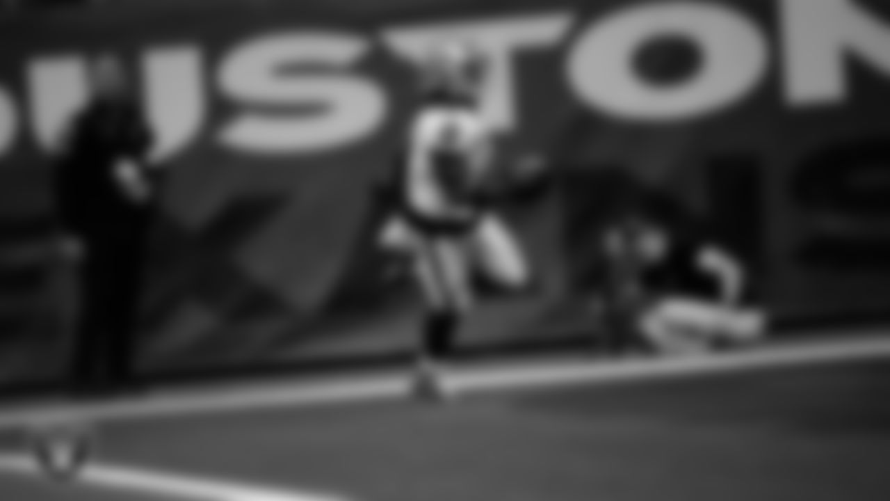 Las Vegas Raiders running back Ashton Jeanty (2) runs after making a 60-yard touchdown catch during the regular season away game against the Houston Texans at NRG Stadium.