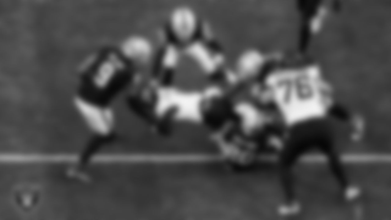 Las Vegas Raiders safety Isaiah Pola-Mao (20) makes a tackle during the regular season home game against the Jacksonville Jaguars at Allegiant Stadium.