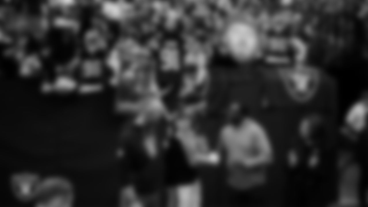 Las Vegas Raiders defensive end Maxx Crosby (98) is awarded the nomination as the Raiders' Walter Payton Man of the Year Award before the regular season home game against the Denver Broncos at Allegiant Stadium.