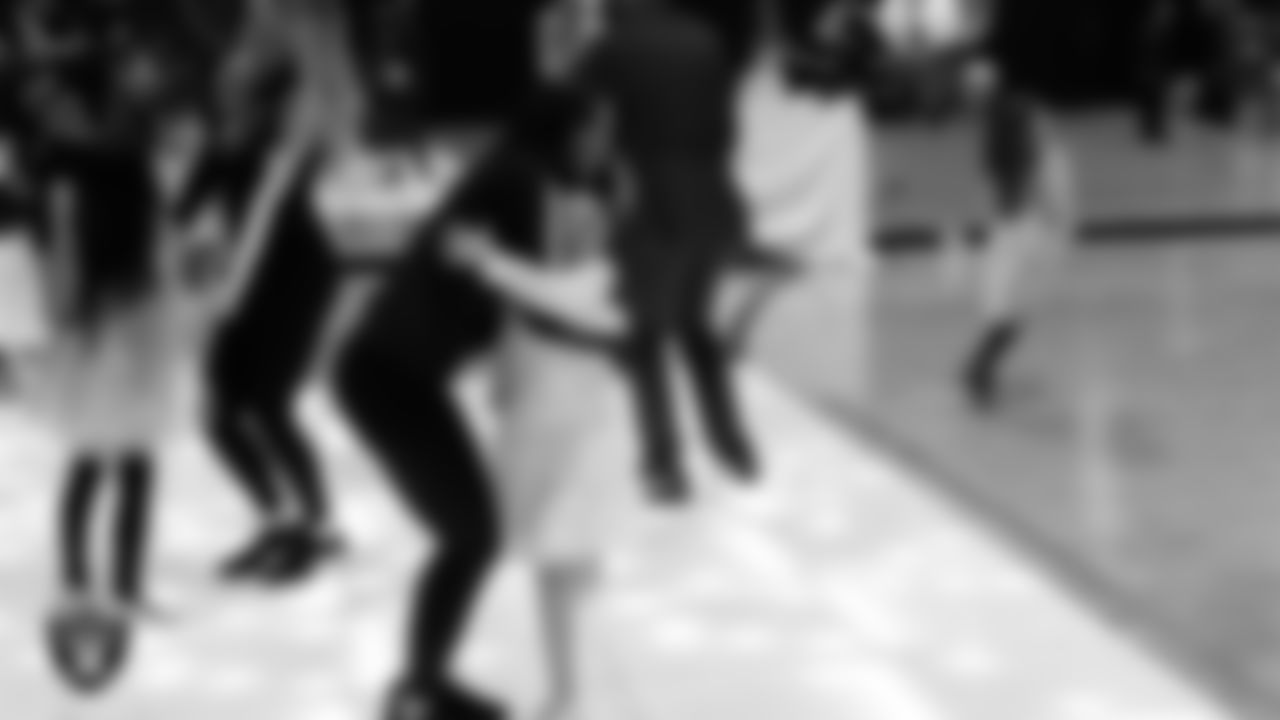 Raiderette Ashtin dances with attendees during the Valentine's Day Dance at The Studio.