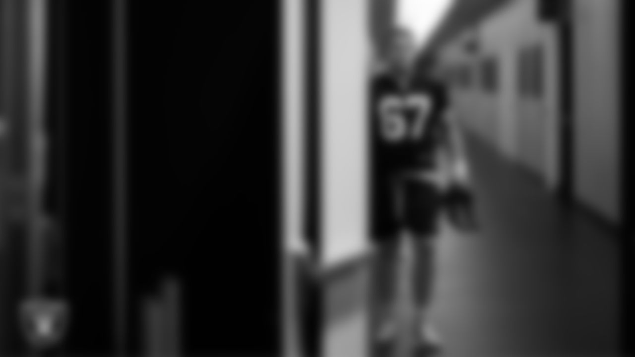 Las Vegas Raiders center Will Putnam (67) walks out to the field for practice at Intermountain Health Performance Center.