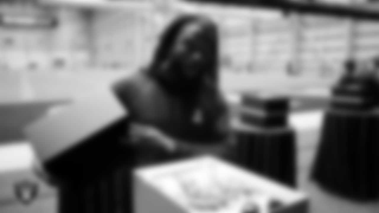 Las Vegas Raiders tight end Ian Thomas (80) unboxes his custom cleats for the NFL's My Cause My Cleats initiative at Intermountain Health Performance Center.