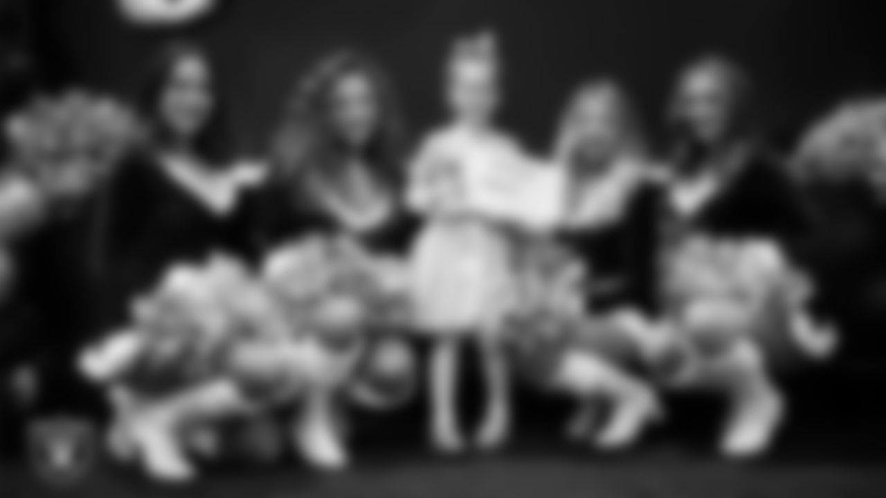 Raiderettes pose for a photo with a Junior Raiderette during the Junior Raiderettes Banquet at The Studio.