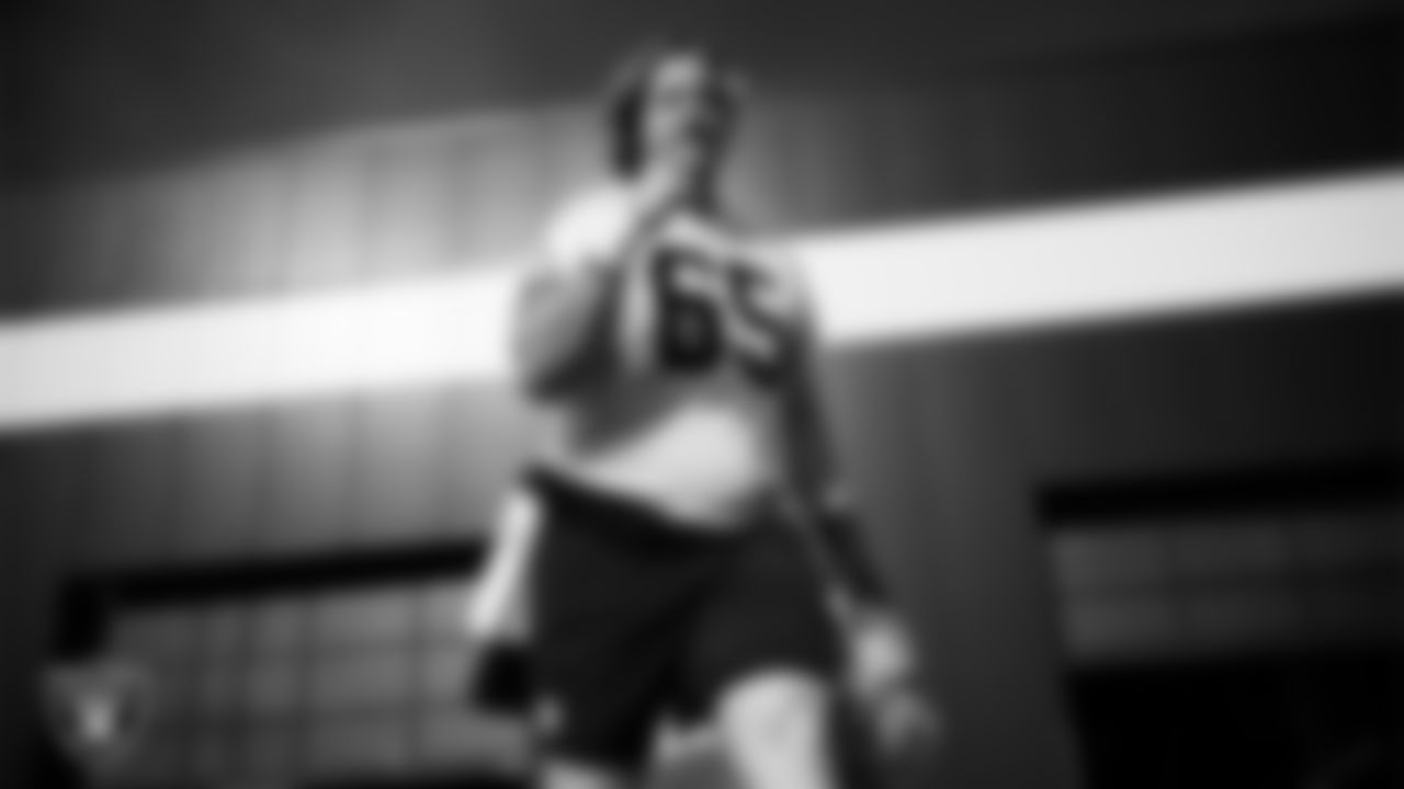 Las Vegas Raiders guard Alex Cappa (65) walks out to the field for practice at Intermountain Health Performance Center.