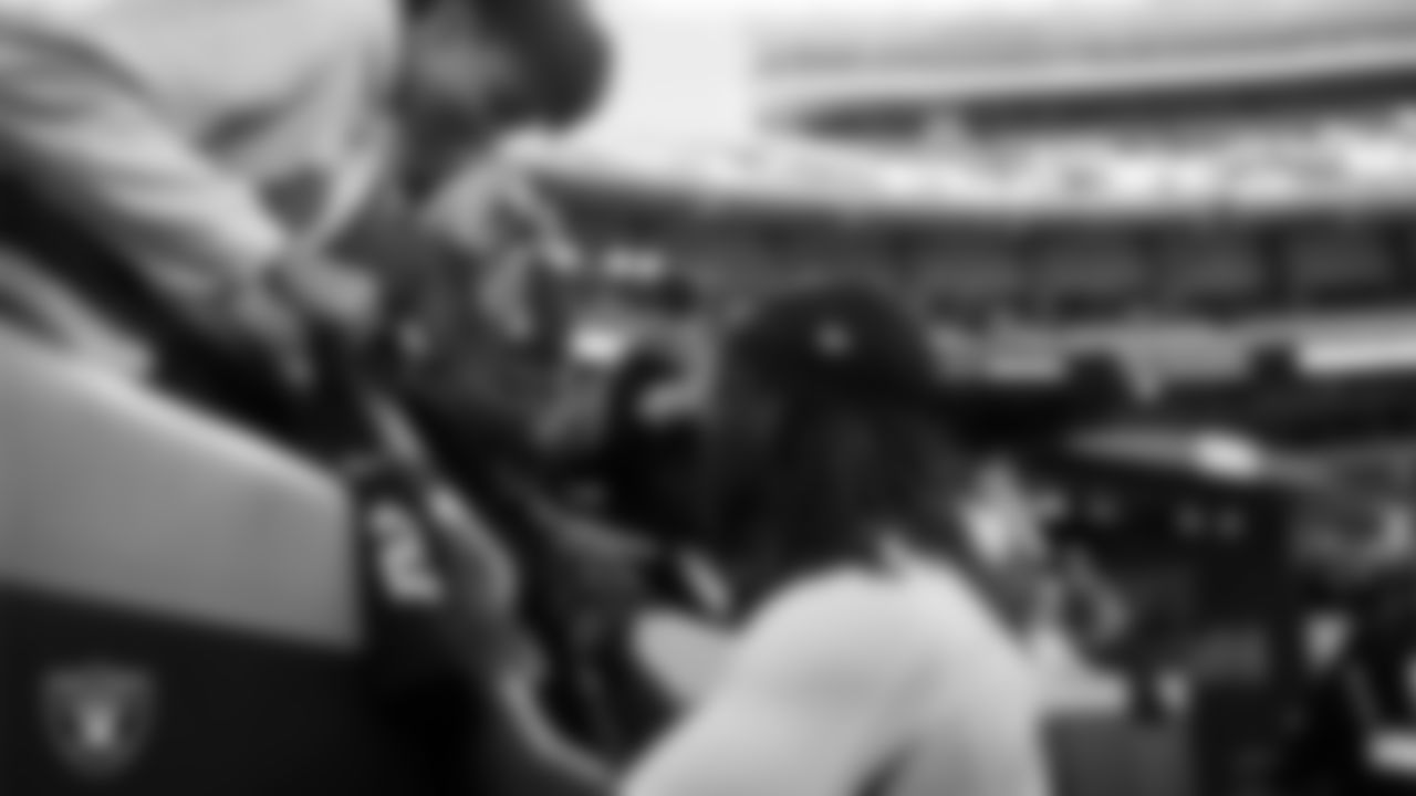 Las Vegas Raiders running back Ashton Jeanty (2) signs autographs for fans before the regular season away game against the Kansas City Chiefs at GEHA Field at Arrowhead Stadium.