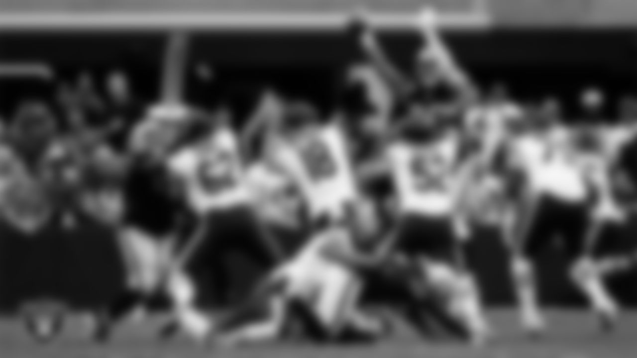 Las Vegas Raiders defensive end Maxx Crosby (98) intercepts a pass during the regular season home game against the Chicago Bears at Allegiant Stadium.