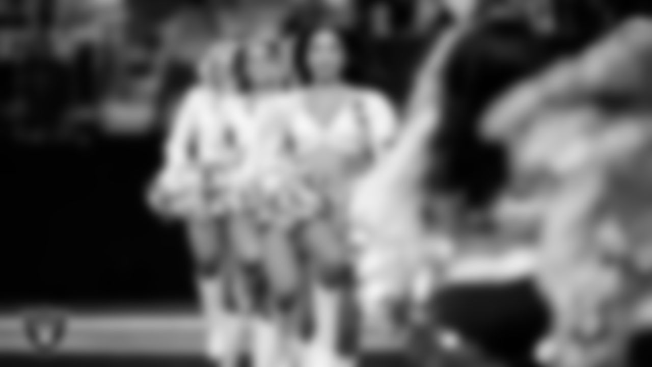 Raiderette Meekela walks onto the field for a performance during the regular season home game against the Jacksonville Jaguars at Allegiant Stadium.