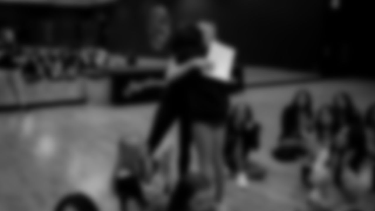 Raiderettes Director Tiphanie McNiff presents a Silver Ticket to a dancer during a recruitment clinic at The Studio.