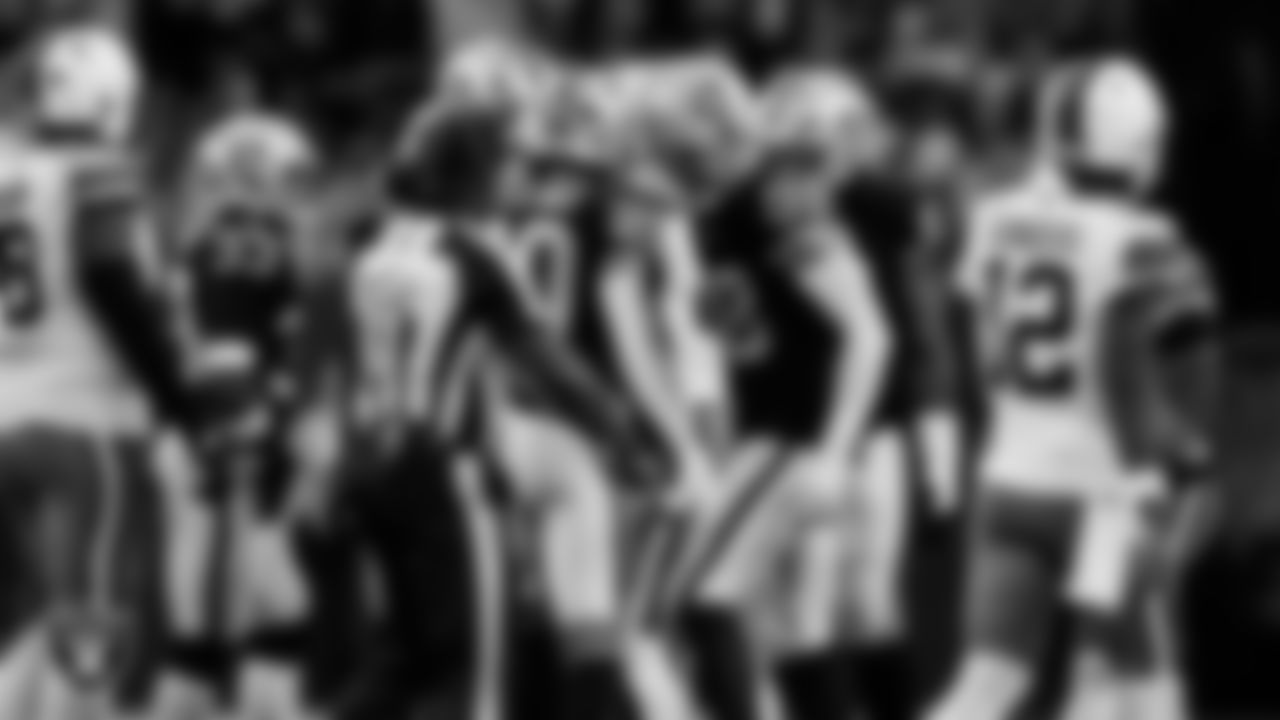 Las Vegas Raiders safety Isaiah Pola-Mao (20) celebrates with defensive end Maxx Crosby (98) after making a tackle during the regular season home game against the Cleveland Browns at Allegiant Stadium.