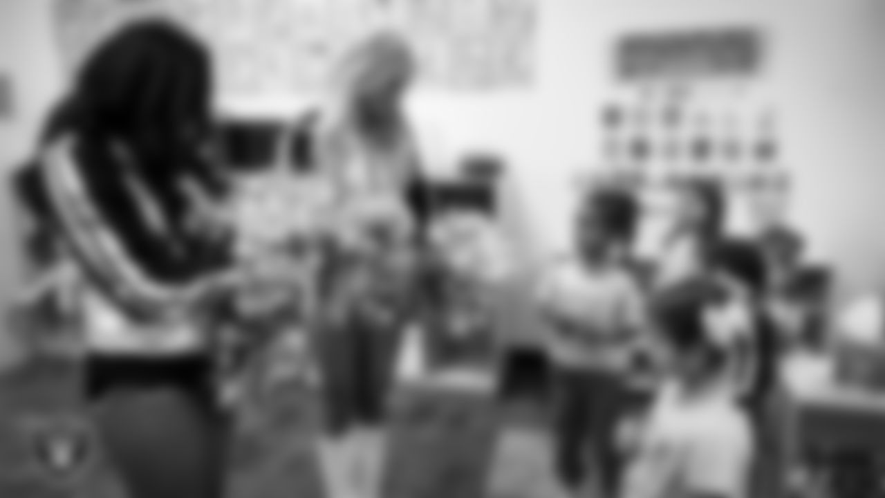 Raiderettes Sloane and Pip speak to students during a 'Lil Raiders Pop-Up at Richard H. Bryan Elementary School.