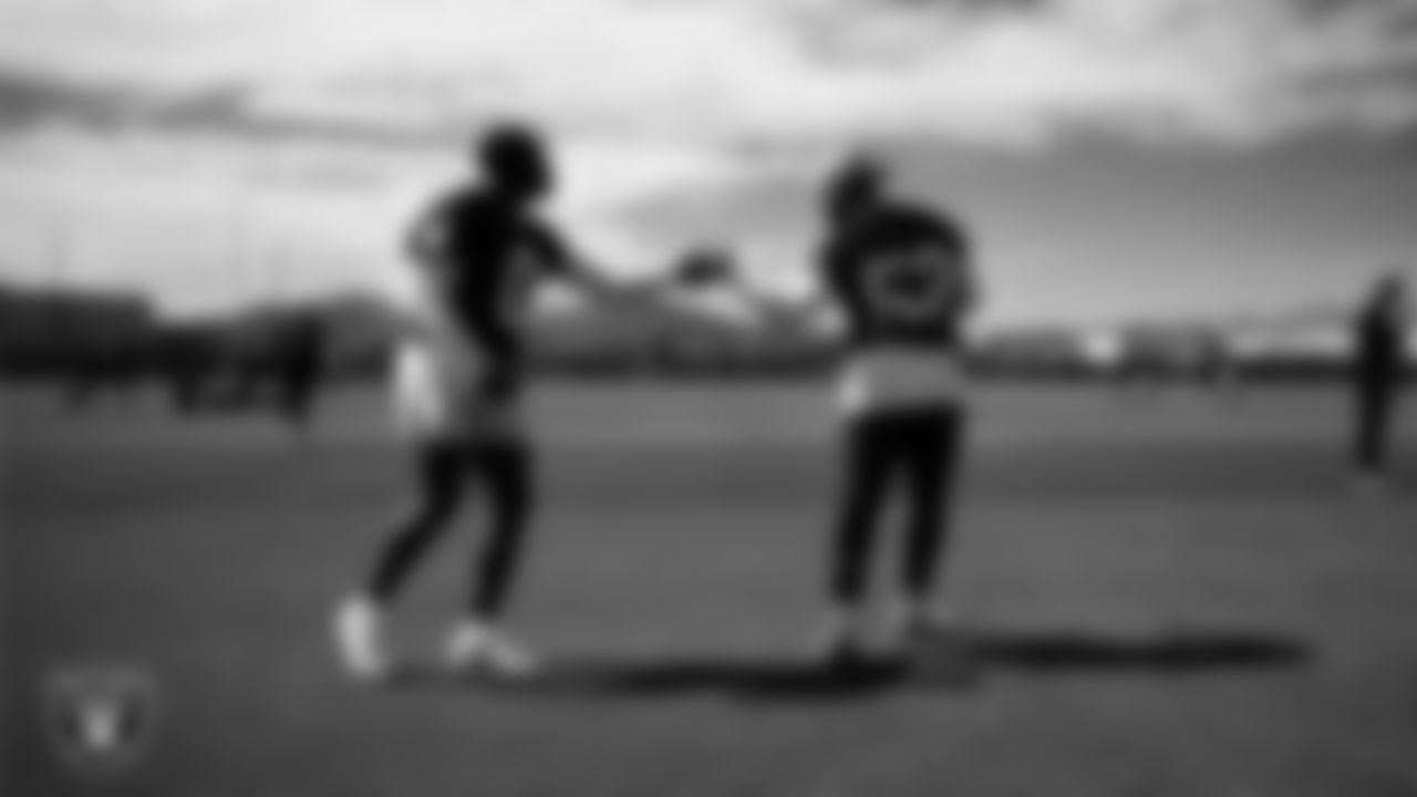 Las Vegas Raiders cornerback Jakorian Bennett (0) and linebacker Elandon Roberts (52) at a workout during phase two of the offseason program at Intermountain Health Performance Center.