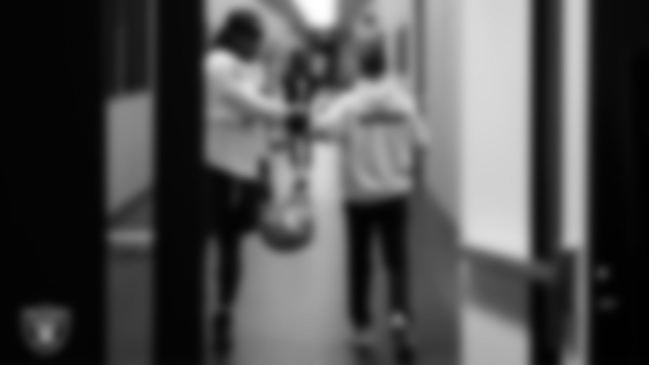 Las Vegas Raiders defensive tackle Tonka Hemingway (97) and wellness coordinator Alex Guerrero during practice at Intermountain Health Performance Center.