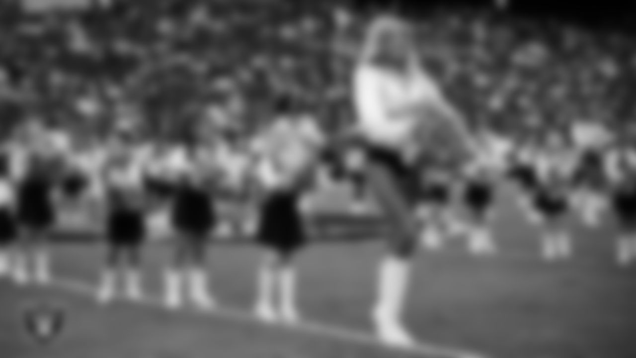 Raiderette Jordie and Junior Raiderettes perform on the field before the preseason home game against the San Francisco 49ers at Allegiant Stadium.